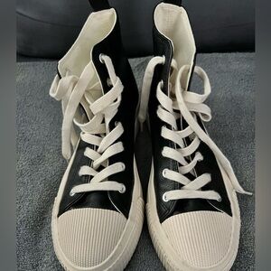 Black and White High-Top Sneakers in used condition
